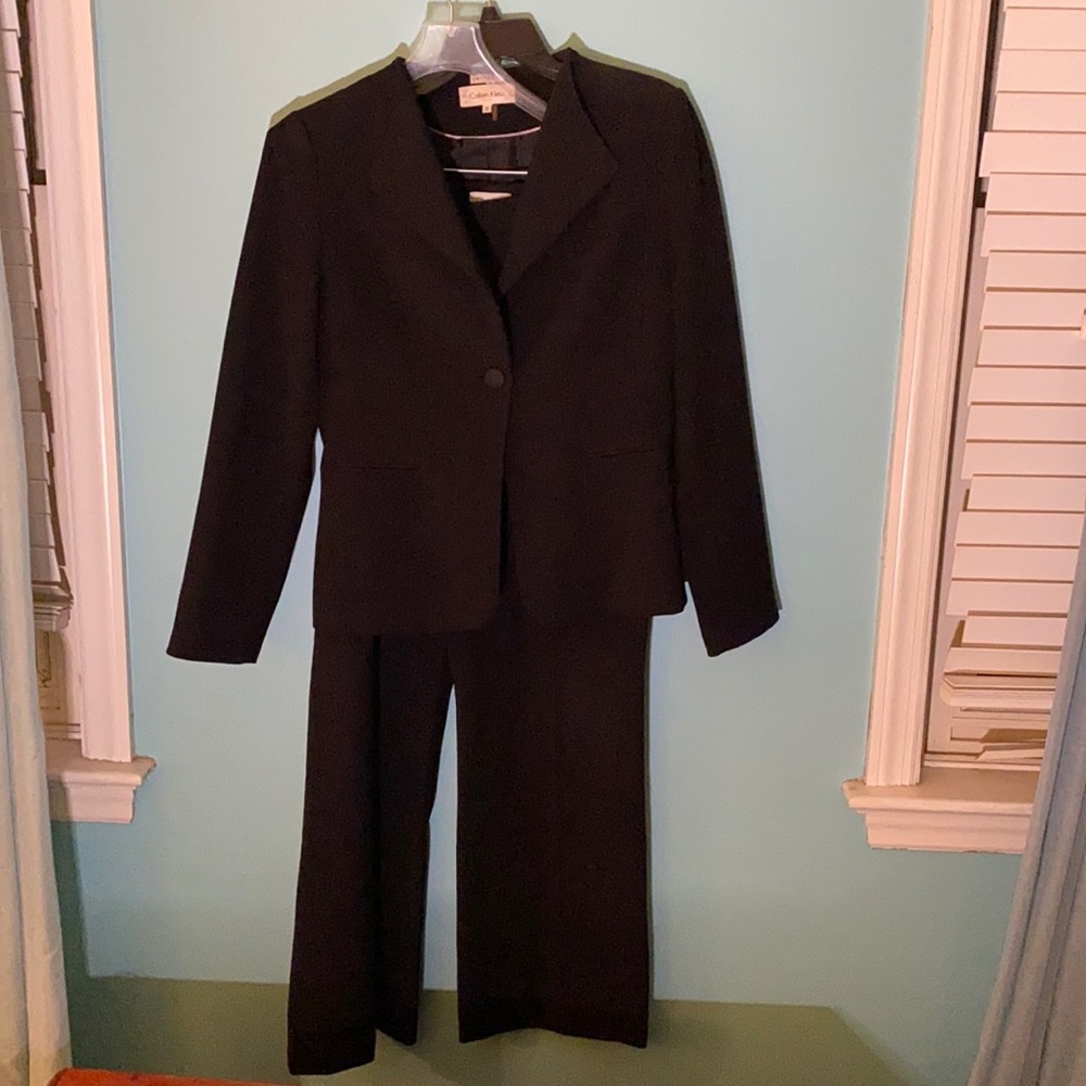 Calvin Klein suit. Black pants and jacket. Material is a heavier weight.